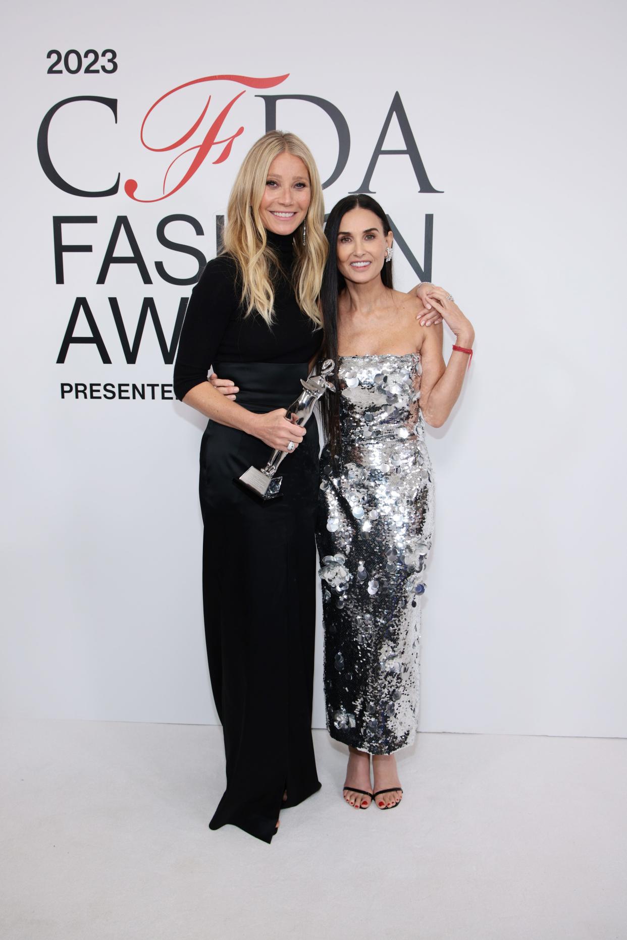 Gwyneth Paltrow and Demi Moore pose together at the CFDA Fashion Awards at the American Museum of Natural History on Monday in New York City.