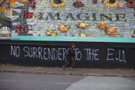 Pro Brexit graffiti on a wall that separates a Protestant area from a Catholic area of West Belfast, Northern Ireland, Tuesday, Oct. 15, 2019. Brexit continues to be a contentious debate around The UK and Northern Ireland. (AP Photo/Peter Morrison)