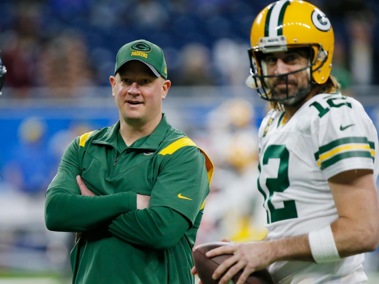 Aaron Rodgers and Nathaniel Hackett prepare for a game against the Detroit Lions.