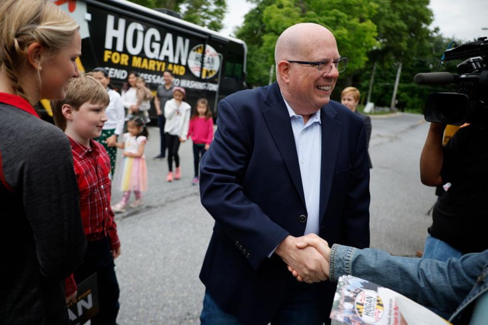 Former Governor Larry Hogan greets supporters on 14 May ahead of the state’s primary elections (Getty Images)