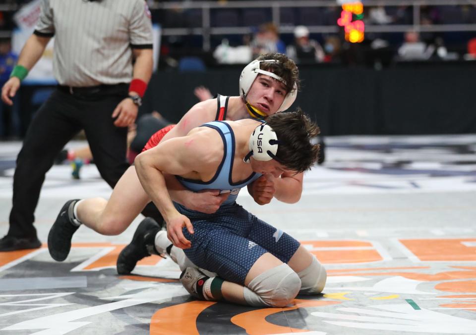 Iona Prep's Eric Grant wrestles Mamaroneck's Owen Deutsch in the consolation rounds of the NYSPHSAA wrestling championships at MVP Arena in Albany on Friday, February 25, 2022. Grant won by pinfall.