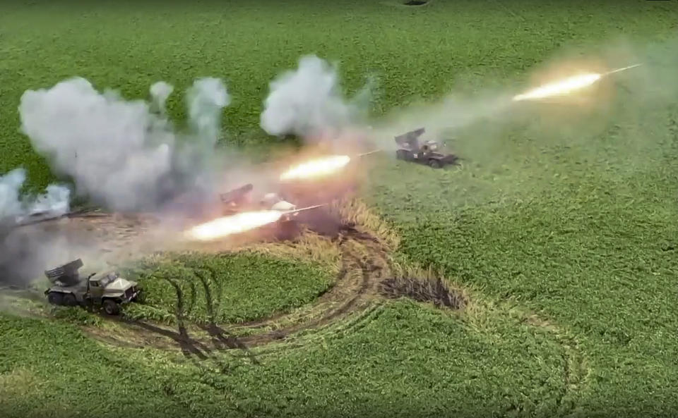 FILE - This handout photo taken from video released by Russian Defense Ministry Press Service on Aug. 8, 2022, shows the Russian military's Grad multiple rocket launchers firing rockets at Ukrainian troops at an undisclosed location. Even as the Kremlin moved to absorb four Ukrainian regions in a sharp escalation of the conflict, the Russian military suffered new stinging defeats that highlighted its deep problems. (Russian Defense Ministry Press Service photo via AP, File)