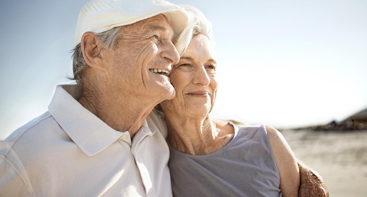 Senior couple embracing, representing loved and lost. (Getty Images)