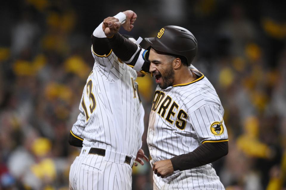 San Diego Padres center fielder Trent Grisham celebrates a home run with third baseman Manny Machado in the fourth inning against the Los Angeles Dodgers.