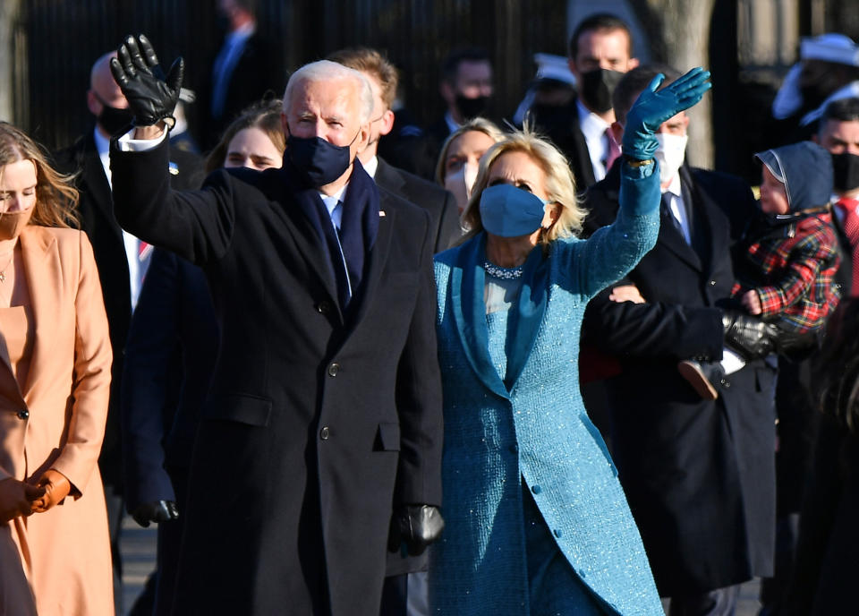 US President Joe Biden, First Lady Jill Biden and their family walk up Pennsylvania Avenue towards the White House in Washington, DC, after Biden and Kamala Harris were sworn in at the US Capitol on January 20, 2021.