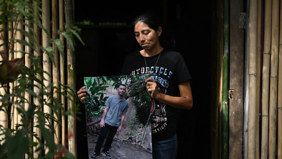 Salvadorean Sandra Hernandez with a picture of her husband Jose Dimas Medrano, who was detained under the state of emergency and died of kidney failure while in prison, in El Rosario, El Salvador, on January 29, 2024. - Stringer/AFP/Getty Images