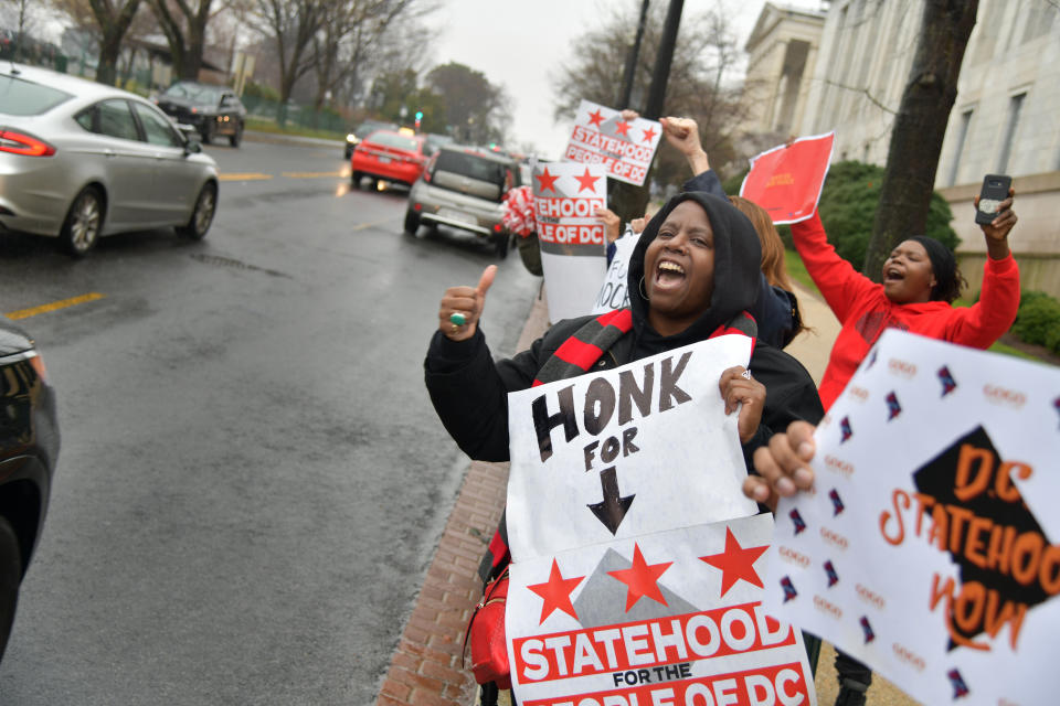 Supporters of statehood for Washington, D.C., cheer as drivers honk their horns in support outside the Rayburn House Office Building on Capitol Hill on Feb. 11, 2020. Statehood advocates are focused on the 2020 election to potentially push their efforts into law. (Photo: The Washington Post via Getty Images)