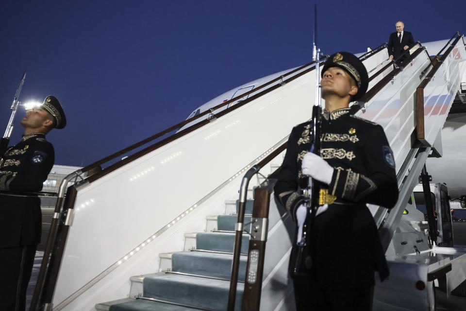 Russian President Vladimir Putin, top right, upon his arrival at an International airport outside Tashkent, Uzbekistan, Sunday, May 26, 2024. (Mikhail Metzel, Sputnik, Kremlin Pool Photo via AP)