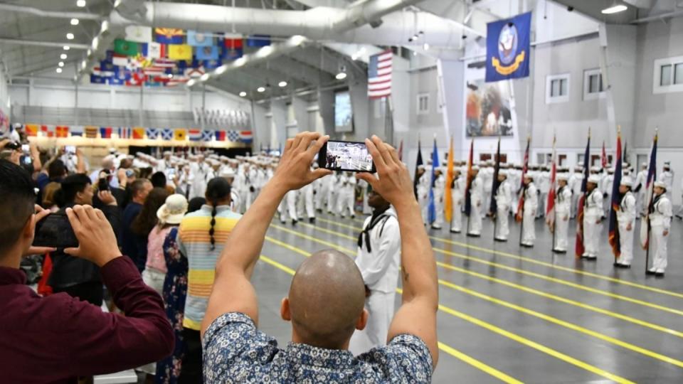 Loved ones watch their freshly sailors graduate at Great Lakes, Illinois, in this undated photo. (Navy)