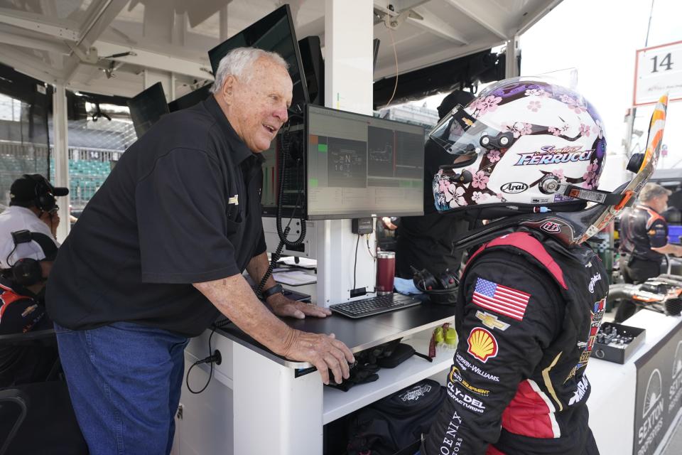 A.J. Foyt talks with Santino Ferrucci during practice for the IndyCar Grand Prix auto race at Indianapolis Motor Speedway, Friday, May 12, 2023, in Indianapolis. Foyt didn't want to go to Indianapolis this month, worrying about what could happen at home without Lucy to oversee things. But he figured Indianapolis Motor Speedway, that historic gray lady on Georgetown Road where he had spent many of his best days, was the right place to help process his grief. (AP Photo/Darron Cummings)