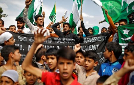 The Wider Image: Barricades and books in restive Kashmir neighbourhood