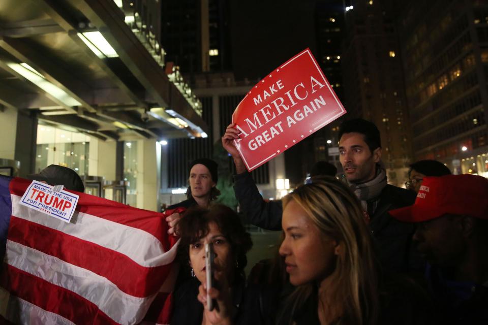 NEW YORK, UNITED STATES - NOVEMBER 9: Supporters of President-elect Donald Trump of Republican Party,celebrate after the results of the 2016 Presidential Elections in Manhattan, New York, United States on November 9, 2016. Republican nominee Donald Trump won victory against Democratic challenger Hillary Clinton on US presidential election.


 (Photo by Mohammed Elshamy/Anadolu Agency/Getty Images)