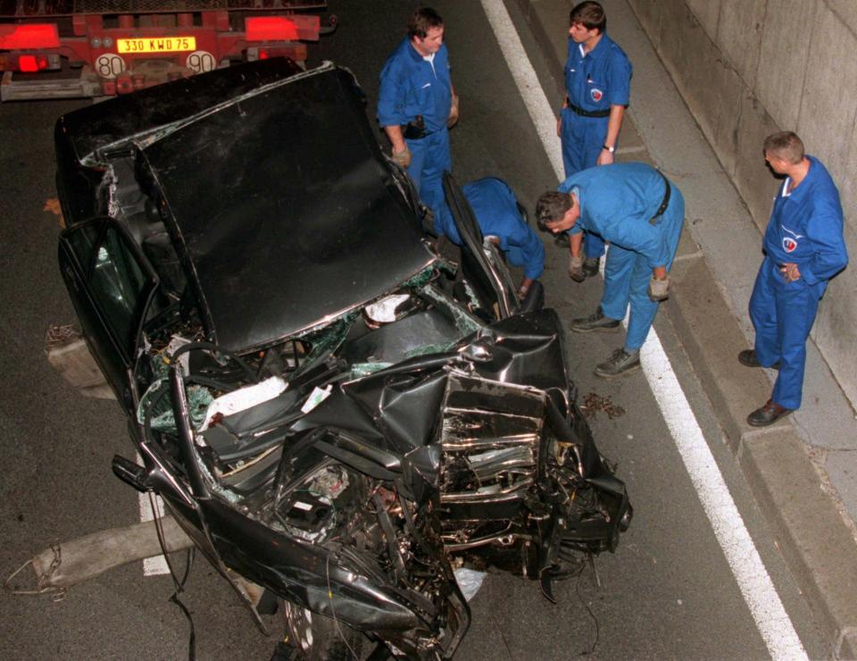 Police services prepare to take away the car in which Diana, Princess of Wales, died early Sunday, Aug. 31, 1997 in Paris, in a car crash that also killed her boyfriend, Dodi Fayed, and the chauffeur. The crash happened shortly after midnight in a tunnel along the Seine River at the Pont de l Alma bridge, while paparazzi on motorcycles were following her car. (AP Photo/Jerome Delay)