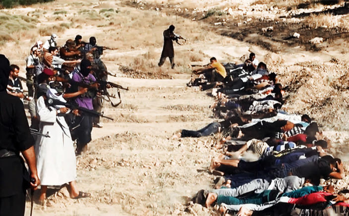 An image uploaded on June 14, 2014 on the jihadist website Welayat Salahuddin allegedly shows militants of the Islamic State of Iraq and the Levant (ISIL) executing dozens of captured Iraqi security forces members in Salaheddin province (AFP Photo/)