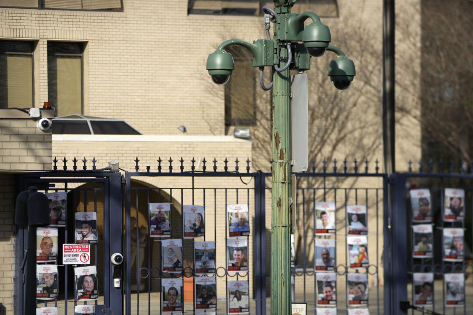 Security cameras are mounted on a pole outside the entrance of the Israeli Embassy, Monday, Feb. 26, 2024, in Washington. An active-duty member of the U.S. Air Force has died after he set himself ablaze outside the Israeli Embassy in Washington, D.C., while declaring that he "will no longer be complicit in genocide." (AP Photo/Mark Schiefelbein)