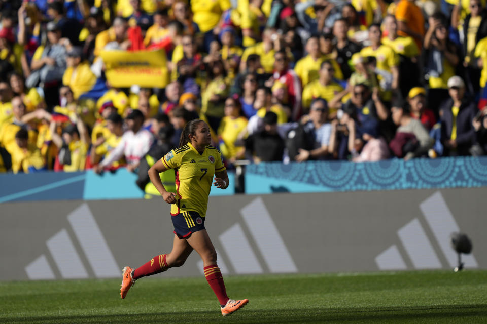 Colombia's Maria Camila Reyes runs to her fans as she celebrates at the end of the Women's World Cup Group H soccer match between Colombia and South Korea at the Sydney Football Stadium in Sydney, Australia, Tuesday, July 25, 2023. (AP Photo/Rick Rycroft)