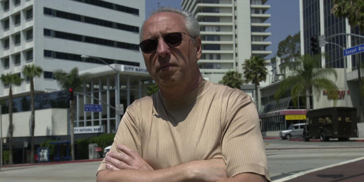 anthony pellicano standing on a street with his arms crossed