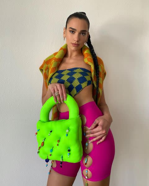 <p>The 25-year-old didn't shy away from bold colours and prints in this pink, green and checkerboard outfit and bag all by Marshall Columbia paired with Jimmy Choo heels and an extra long plait. </p><p><a class="link " href="https://www.net-a-porter.com/en-gb/shop/designer/jimmy-choo" rel="nofollow noopener" target="_blank" data-ylk="slk:SHOP JIMMY CHOO NOW">SHOP JIMMY CHOO NOW</a></p><p><a href="https://www.instagram.com/p/CMNO9Z8Mvnl/" rel="nofollow noopener" target="_blank" data-ylk="slk:See the original post on Instagram" class="link ">See the original post on Instagram</a></p>