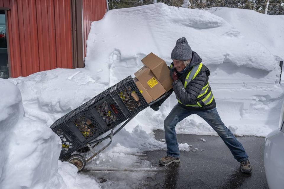 Ben Holder, of Stohlgren Bros. in Truckee, makes a delivery to the Soda Springs Store earlier this month. Holder said he has been busy making deliveries despite the heavy snow that fell in the area. Hector Amezcua/hamezcua@sacbee.com