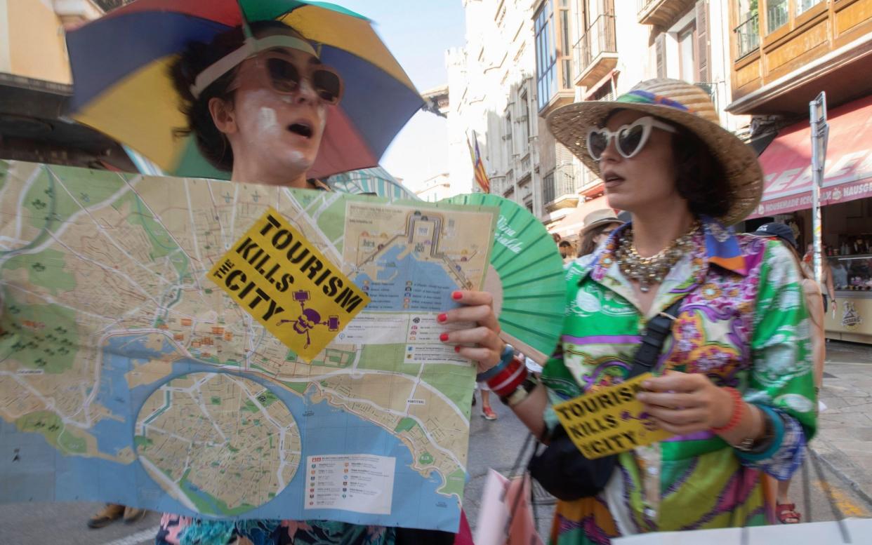 Demonstrators take part in a protest against mass tourism in Mallorca