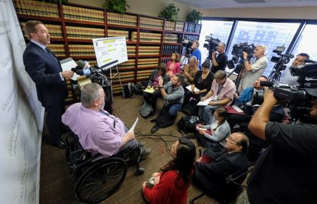 Geoffrey Johnson and his attorney Daniel J. Callahan speak in a news conference announcing a lawsuit against his former lawyer Michael Avenatti over a 4 million dollar settlement with the County of Los Angeles in Santa Ana