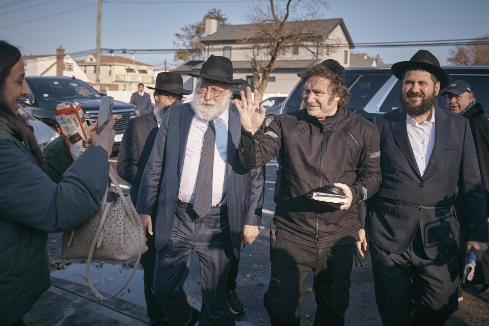 Argentina's President-elect, Javier Milei, center right, arrives to pray next to Chabad-Lubavitch rabbis at the resting place of the Rebbe, Rabbi Menachem Mendel Schneerson, at Montefiore Cemetery on Monday, Nov. 27, 2023, in the Queens borough of New York. (AP Photo/Andres Kudacki)