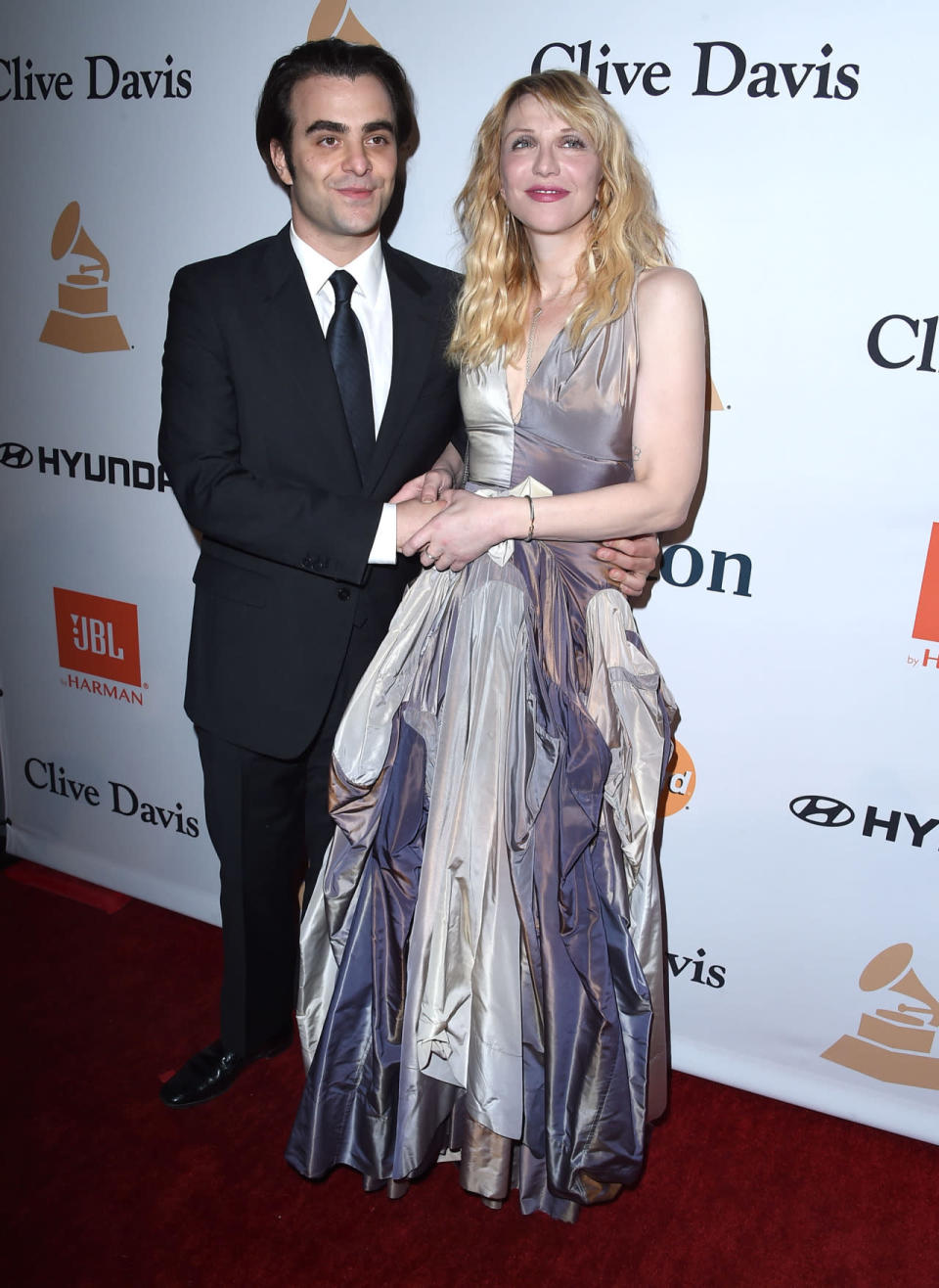 Nicholas Jarecki with Courtney Love (in Vivienne Westwood) at Clive Davis’s Pre-Grammy party. 