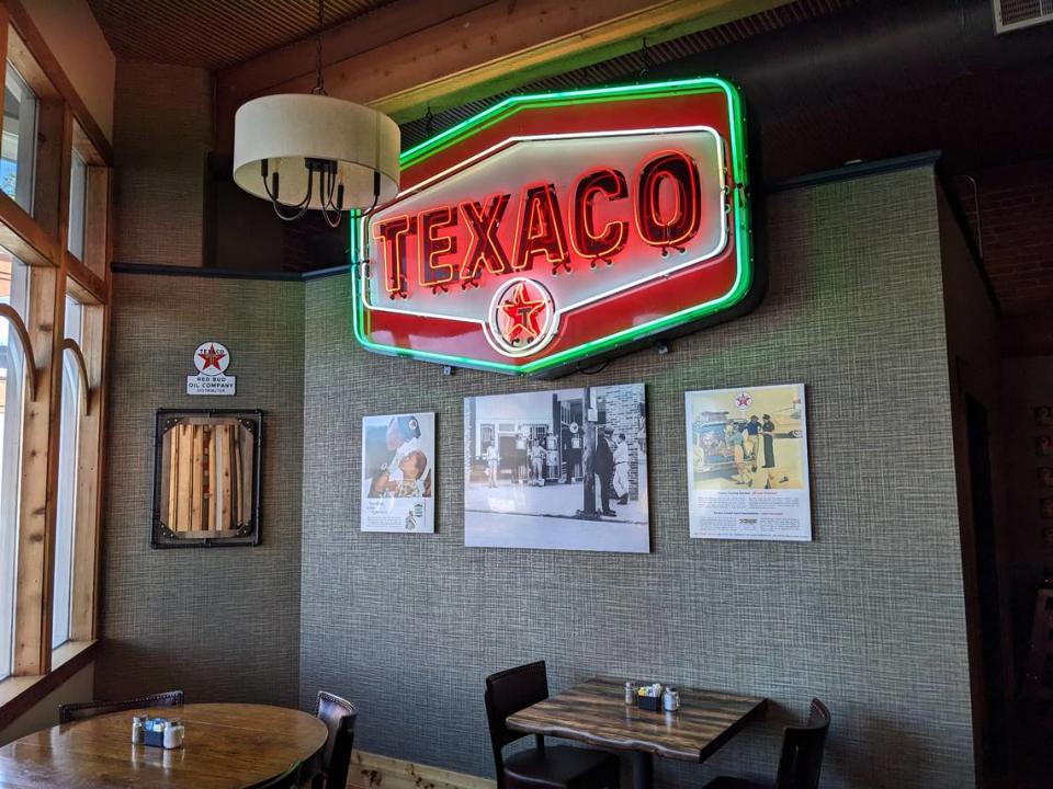 An old neon Texaco sign is the highlight of the Texaco Room at 1860 Public House in Red Bud.