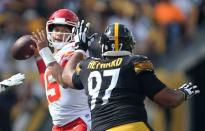 Sep 16, 2018; Pittsburgh, PA, USA; Kansas City Chiefs quarterback Patrick Mahomes (15) passes against pressure from Pittsburgh Steelers defensive tackle Cameron Heyward (97) during the fourth quarter at Heinz Field. Kansas City won 42-37. Mandatory Credit: Charles LeClaire-USA TODAY Sports