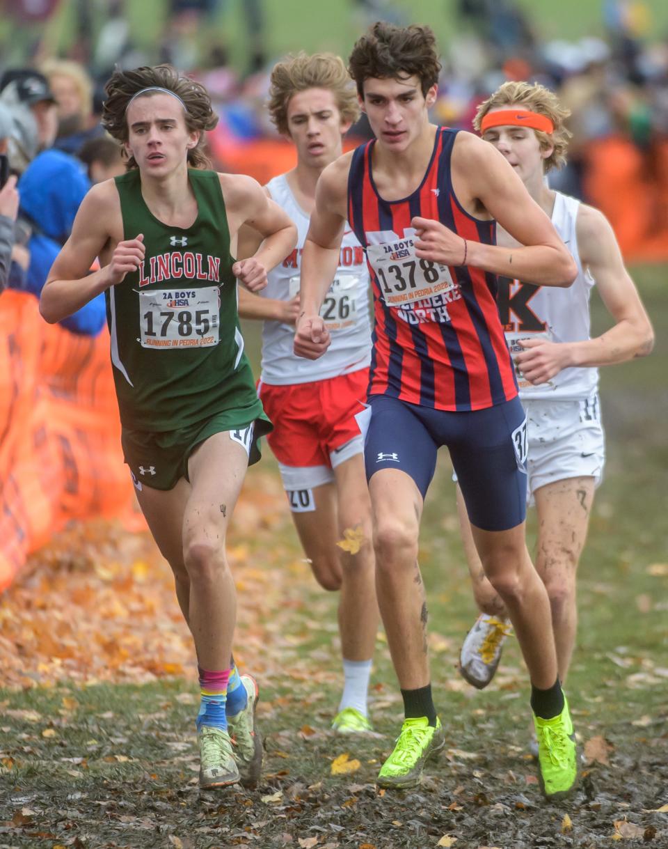 Lincoln's Brenden Heitzig (1785) battles Belvidere North's Evan Horgan (1378) in the Class 2A boys state cross-country meet Saturday, Nov. 5, 2022 at Detweiller Park in Peoria.
