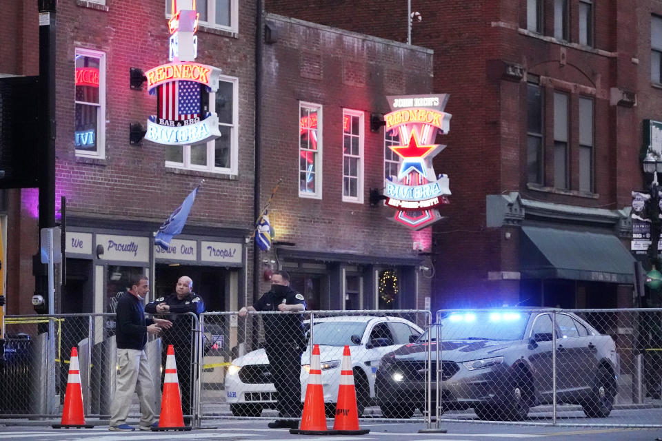 Police block off a part of the Broadway tourist district Monday, Dec. 28, 2020, as a result of a bombing that took place on Christmas Day in Nashville, Tenn. The explosion sparked shock across the country, killed the bomber, injured three other people and damaged dozens of buildings. Yet for those who call Music City home, the bombing feels like a cruel capstone to an already dark year. (AP Photo/Mark Humphrey)