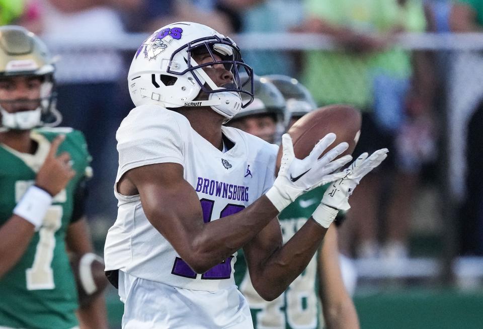 Brownsburg Bulldogs Corey Smith (12) catches the ball Friday, Sept. 22, 2023, during the game against the Westfield Shamrocks at Westfield High School in Westfield. Brownsburg Bulldogs defeated the Westfield Shamrocks, 37-7.