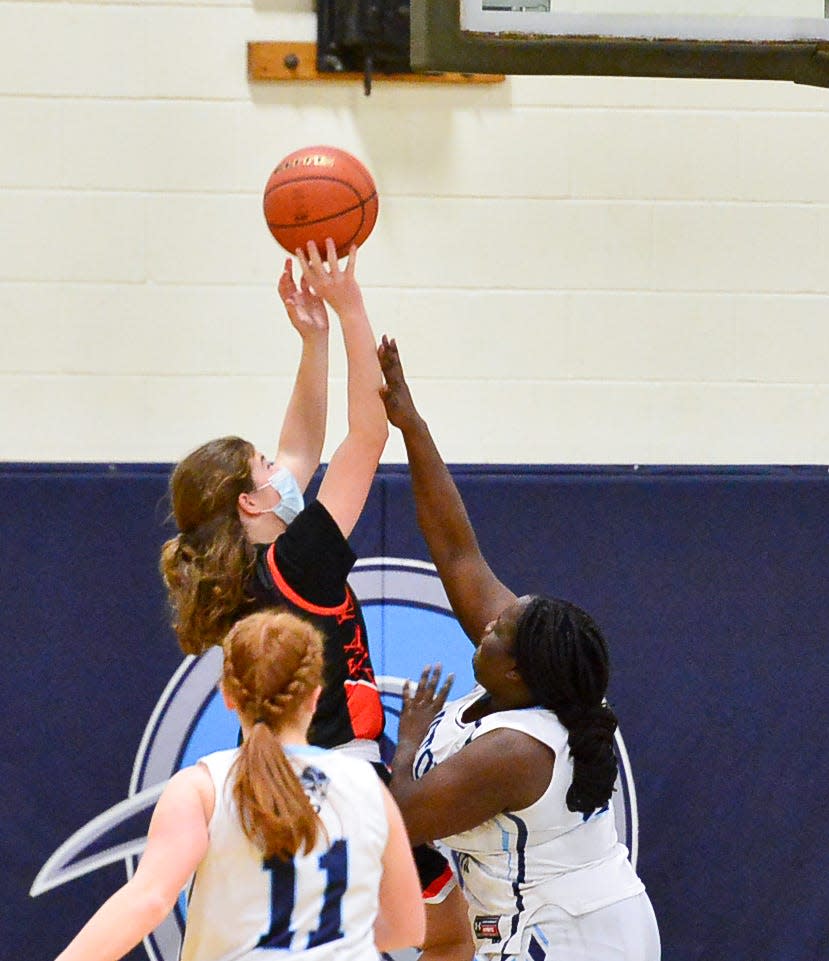 Diman’s Elizabeth Kinnane takes a shot past Bristol-Plymouth’s Christele Derogene.