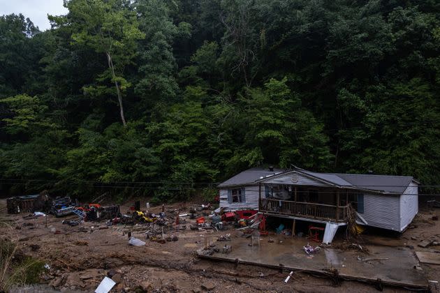 Debris surrounds a badly damaged home near Jackson, Kentucky, on July 31. (Photo: SETH HERALD/AFP/Getty Images)