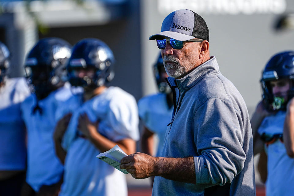 Higley High School football offensive coordinator Noel Mazzone coaches during a practice at the campus football field in Gilbert on Nov. 15, 2022.