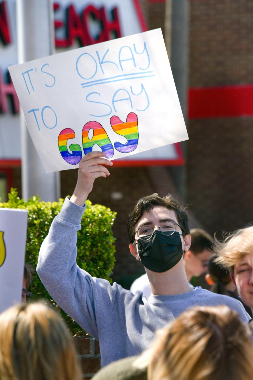 Fort Walton Beach High School student Ivan Gutierrez holds a sign protesting the recent Florida legislation dubbed the "Don't Say Gay" bill.