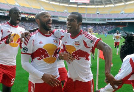 Nov 8, 2014; Washington, DC, USA; New York Red Bulls forward Thierry Henry (left) and defender Roy Miller (7) celebrate after a New York Red Bulls goal against the D.C. United during the second half at Robert F. Kennedy Memorial. Mandatory Credit: Brad Mills-USA TODAY Sports