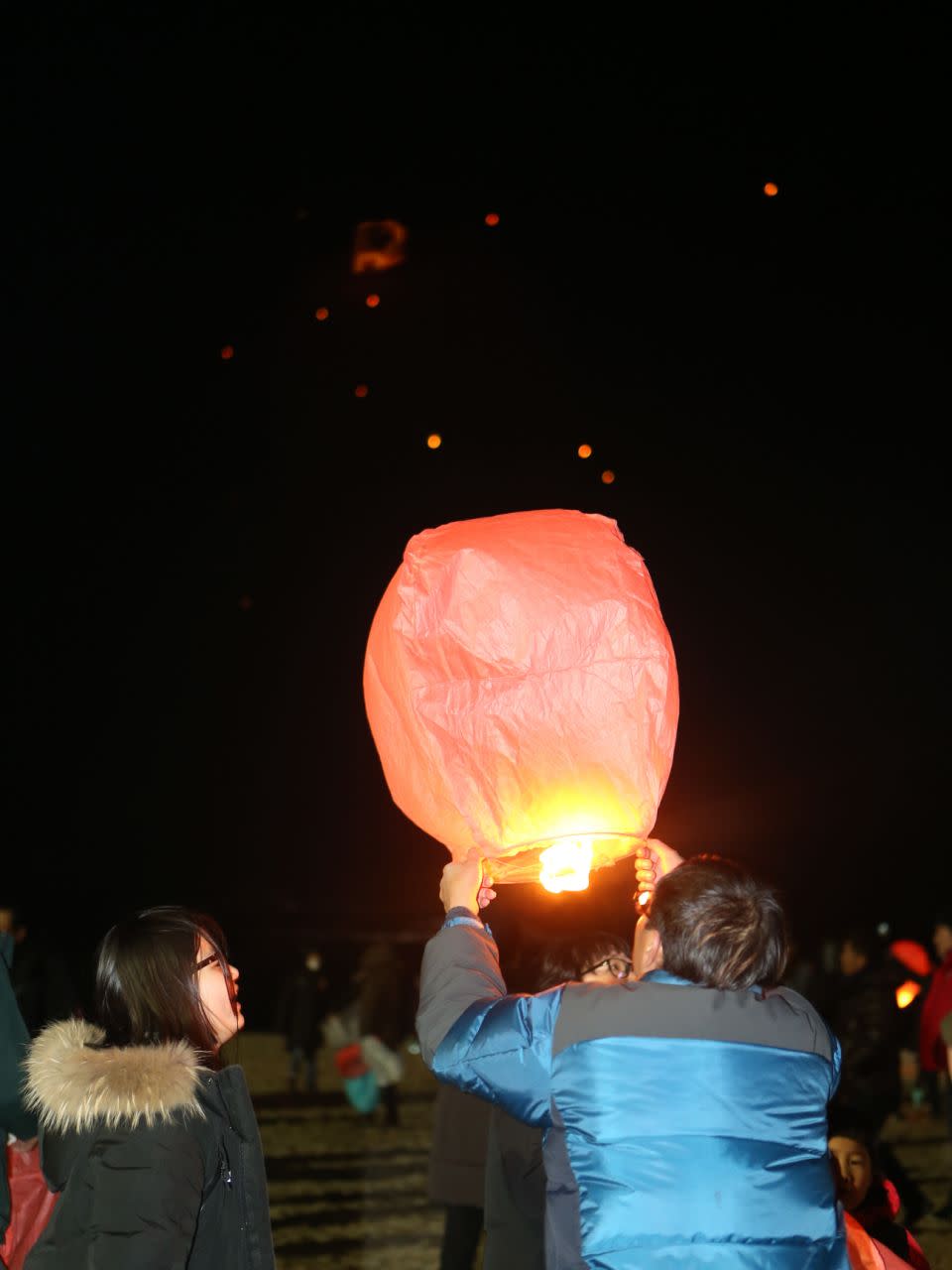 Lanterns are lit in memory of ferry disaster victims, January 2017. Photo: AAP