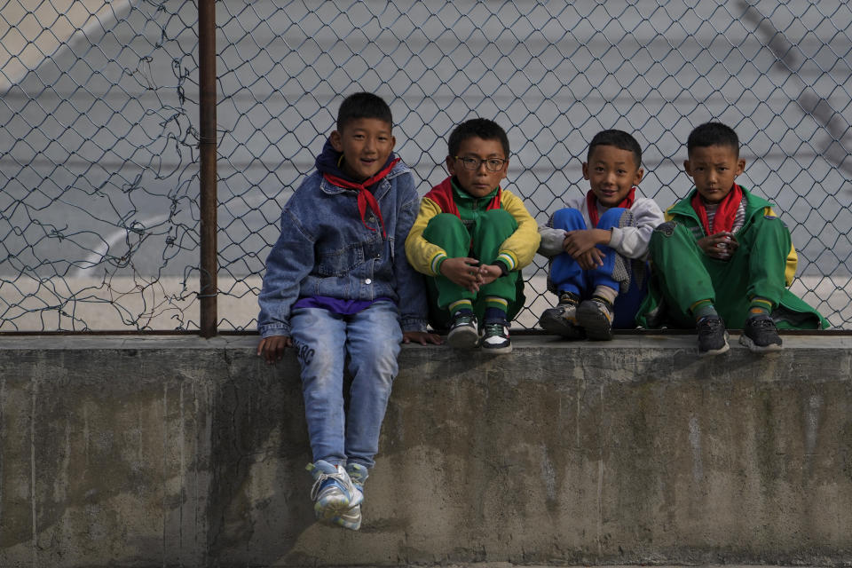 Tibetan students look during their break time at the Shangri-La Key Boarding School during a media-organized tour in Dabpa county, Kardze Prefecture, Sichuan province, China on Sept. 5, 2023. (AP Photo/Andy Wong)