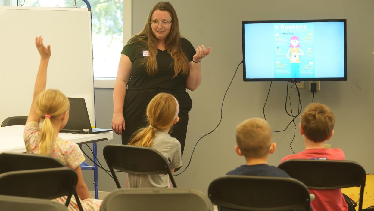Hannah Swift teaches a group of 7- to 9-year-old children social media safety skills at a Gracehaven event in August to educate young people on warning signs of human trafficking.