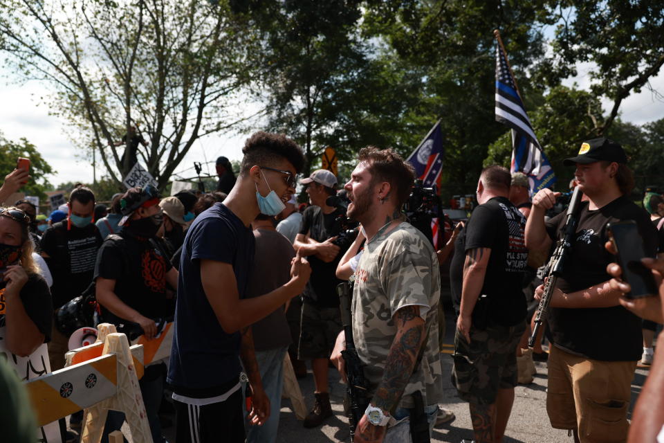 Protesters and counter protesters face off as the protest continues on August 15, 2020 near the downtown of Stone Mountain, Georgia.  / Credit: Getty Images