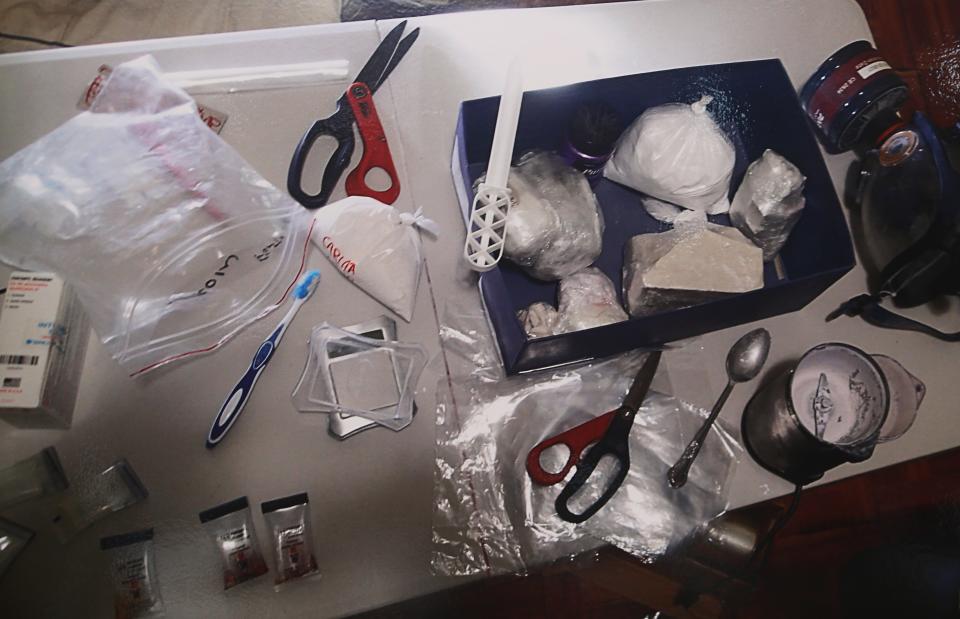 A photo shown at a press conference on February 21, 2023 shows an image of recovered drugs that were routinely left in a wooded area in Hockessin.