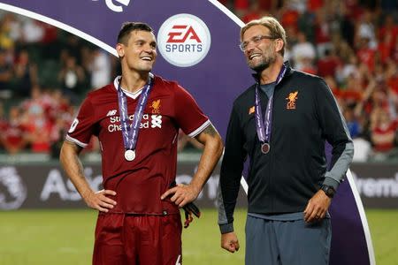 Soccer Football - Leicester City v Liverpool - Pre Season Friendly - The Premier League Asia Trophy - Final - June 22, 2017 Liverpool manager Juergen Klopp celebrates with Dejan Lovren at the end of the match REUTERS/BOBBY YIP