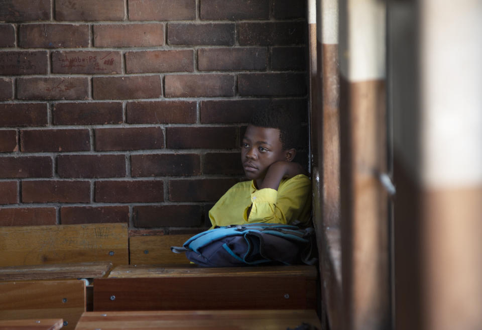 A student sits in class at the Seipone Secondary School in the rural village of Ga-Mashashane, near Polokwane, South Africa, Thursday May 4, 2023. Human rights groups have been pressuring the government for a decade to get rid of pit toilets in schools, with the issue given added urgency by several tragic cases of young children falling into the pits and drowning. (AP Photo/Denis Farrell)