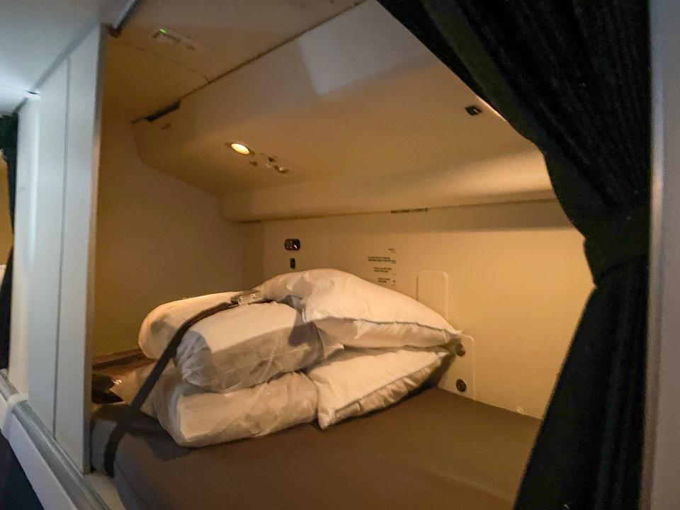 In each bed area, there's pillows and blankets for the flight attendant.