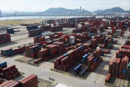 FILE PHOTO: Shipping containers are seen stacked at the Dachan Bay Terminals in Shenzhen, Guangdong province, China July 12, 2018. REUTERS/Stringer/File Photo