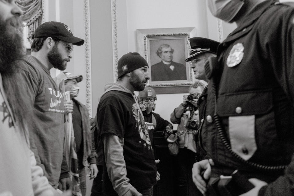 Pro-Trump rioters confront Capitol Police officers after breaking into the Capitol.<span class="copyright">Christopher Lee for TIME</span>