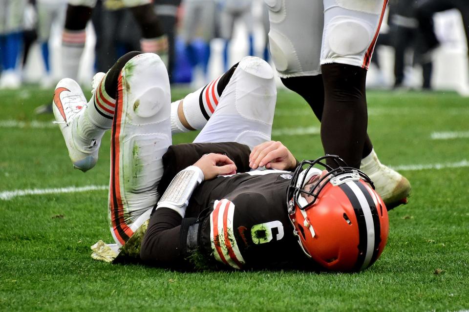 Baker Mayfield #6 of the Cleveland Browns lays on the field after a play in the second half against the Detroit Lions at FirstEnergy Stadium on November 21, 2021 in Cleveland, Ohio.