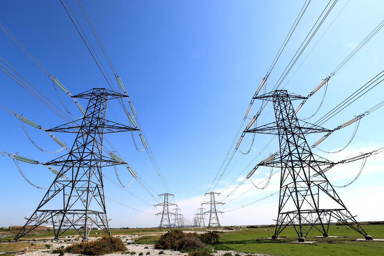 Electricity pylons carry power away from Dungeness nuclear power station in Kent as the National Grid warned that a record low demand for electricity during the UK's coronavirus lockdown could lead to windfarms and power plants being turned off to avoid overloading the electricity grid. (Photo by Gareth Fuller/PA Images via Getty Images)