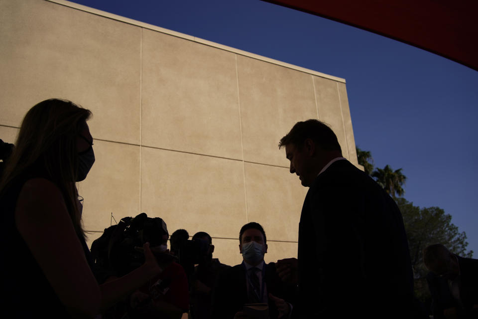 Former U.S. Sen. Dean Heller, right, speaks with the media at an event at Share Village Las Vegas after announcing a bid for governor of Nevada, Monday, Sept. 20, 2021, in Las Vegas. (AP Photo/John Locher)